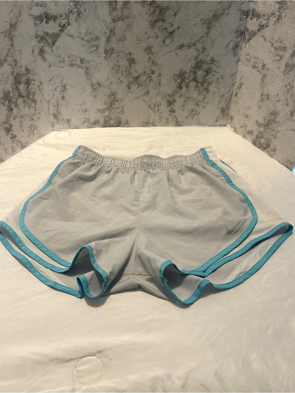 Nike Women’s Light Gray Athletic Shorts with Teal Trim